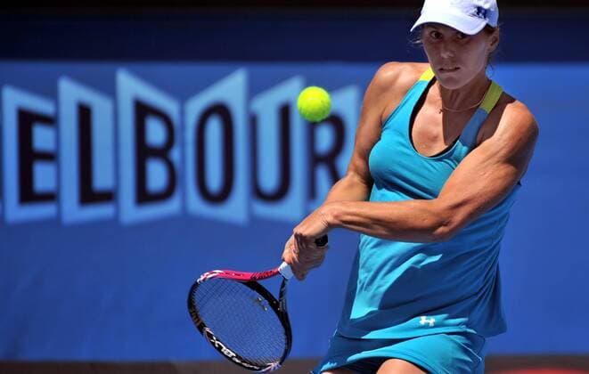 Lepchenko Varvara of the United States hits a return during the 1st round of women s singles match on day 1 of 2012 Australian Open tennis tournament at Melbourne Park 