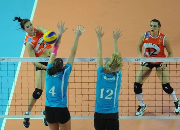 Women champions league group A volleyball match between Eczacibasi Vitra (orange) and SC Schweriner ( blue) at Burhan Felek Hall in Istanbul. 17.01.2012 Scored: Eczacibasi Vitra 3 - SC Schweriner 2 1. set 29-31 2. set 25-20 3. set 25 21 4. set 22-25 5. set 15-12 Pictured: Neslihan Darnel (17) and Esra Gumus (12) of Eczacibasi Vitra. 
