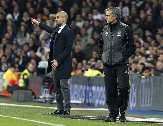 Real Madrid s coach Jose Mourinho (r) and FC Barcelona s coach Josep Pep Guardiola during Spanish King s Cup match.January 18,2011.  (201201182430)