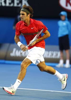 Australian Open 2012, Melbourne Park,ITF Grand Slam Tennis Tournament,Roger Federer (SUI) Aktion,Einzelbild,Ganzkoerper,Hochformat,
