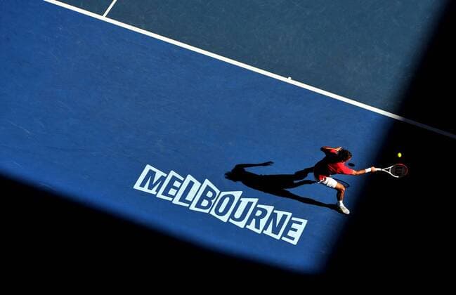 (120124) -- MELBOURNE, Jan. 24, 2012 (Xinhua) -- Roger Federer of Switzerland hits a return during the men s singles quarterfinals match at the 2012 Australian Open tennis tournament in Melbourne, Australia, Jan. 24, 2012. (Xinhua Chen Xiaowei) (jyc) AUSTRALIA-MELBOURNE-TENNIS-AUSTRALIAN OPEN-MEN S SINGLES 