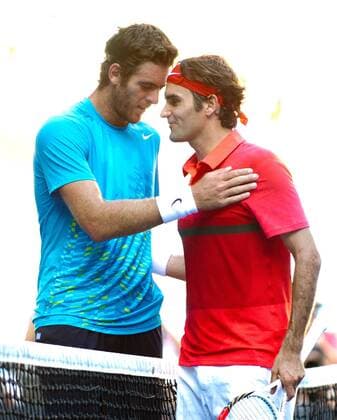 (120124) -- MELBOURNE, Jan. 24, 2012 (Xinhua) -- Roger Federer (R) of Switzerland greets Juan Martin Del Potro of Argentina after their men s singles quarterfinals match at the 2012 Australian Open tennis tournament in Melbourne, Australia, Jan. 24, 2012. Federer won 3-0. (Xinhua Bai Xue) (jyc) AUSTRALIA-MELBOURNE-TENNIS-AUSTRALIAN OPEN-MEN S SINGLES 
