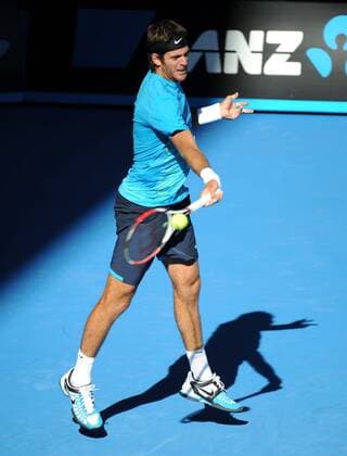 (120124) -- MELBOURNE, Jan. 24, 2012 (Xinhua) -- Juan Martin Del Potro of Argentina hits a return during the men s singles quarterfinals match at the 2012 Australian Open tennis tournament in Melbourne, Australia, Jan. 24, 2012. (Xinhua Guo Yong) (jyc) AUSTRALIA-MELBOURNE-TENNIS-AUSTRALIAN OPEN-MEN S SINGLES 