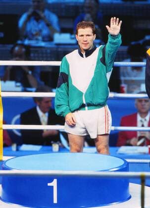 Boxing : Mens Welterweight Final. Barcelona Olympics 1992. Medal Presentation. Michael Carruth (Ireland) salutes the crowd after winning the Gold medal. 