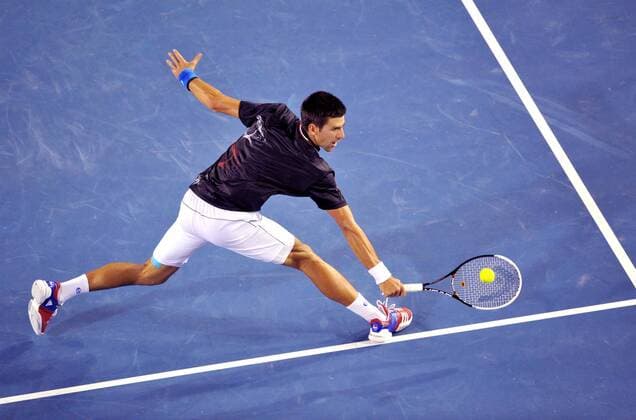 (120129) -- MELBOURNE, Jan. 29, 2012 (Xinhua) -- Novak Djokovic of Serbia hits a return during their men s singles final at 2012 Australian Open tennis tournament in Melbourne, Australia, on Jan. 29, 2012. (Xinhua Chen Xiaowei) (hy) AUSTRALIA-MELBOURNE-TENNIS-MEN S-FINAL 