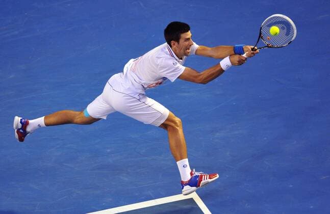 (120129) -- MELBOURNE, Jan. 29, 2012 (Xinhua) -- Novak Djokovic of Serbia hits a return during their men s singles final at 2012 Australian Open tennis tournament in Melbourne, Australia, on Jan. 29, 2012. (Xinhua Chen Xiaowei) (hy) AUSTRALIA-MELBOURNE-TENNIS-MEN S-FINAL 