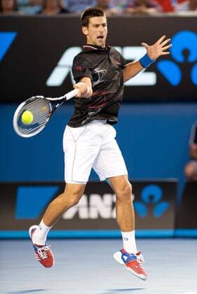 (120129) -- MELBOURNE, Jan. 29, 2012 (Xinhua) -- Novak Djokovic of Serbia hits a return during their men s singles final at 2012 Australian Open tennis tournament in Melbourne, Australia, on Jan. 29, 2012. (Xinhua Bai Xue) (hy) AUSTRALIA-MELBOURNE-TENNIS-MEN S-FINAL 