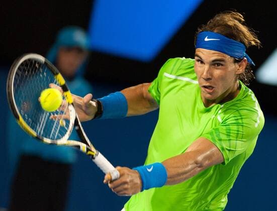 (120129) -- MELBOURNE, Jan. 29, 2012 (Xinhua) -- Rafael Nadal of Spain hits a return during their men s singles final at 2012 Australian Open tennis tournament in Melbourne, Australia, on Jan. 29, 2012. (Xinhua Bai Xue) (hy) AUSTRALIA-MELBOURNE-TENNIS-MEN S-FINAL 