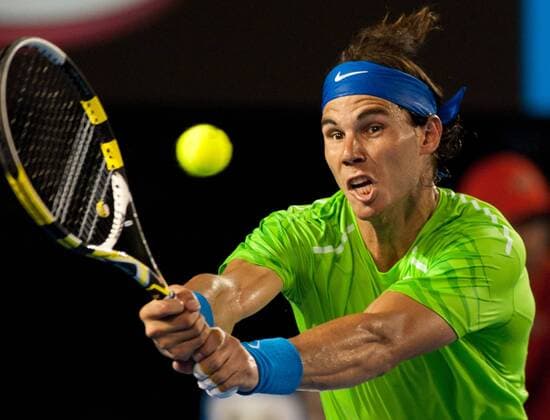 (120129) -- MELBOURNE, Jan. 29, 2012 (Xinhua) -- Rafael Nadal of Spain hits a return during their men s singles final at 2012 Australian Open tennis tournament in Melbourne, Australia, on Jan. 29, 2012. (Xinhua Bai Xue) (hy) AUSTRALIA-MELBOURNE-TENNIS-MEN S-FINAL 