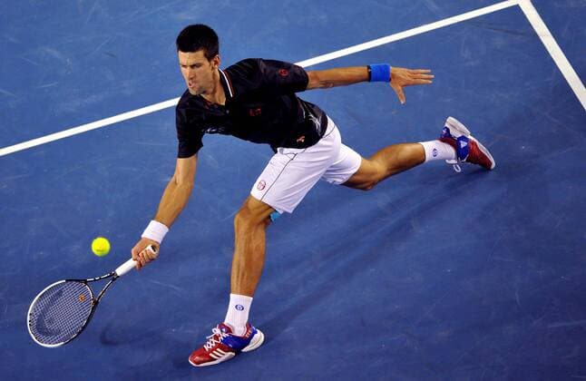 (120129) -- MELBOURNE, Jan. 29, 2012 (Xinhua) -- Novak Djokovic of Serbia hits a return during their men s singles final at 2012 Australian Open tennis tournament in Melbourne, Australia, on Jan. 29, 2012. (Xinhua Chen Xiaowei) (hy) AUSTRALIA-MELBOURNE-TENNIS-MEN S-FINAL 