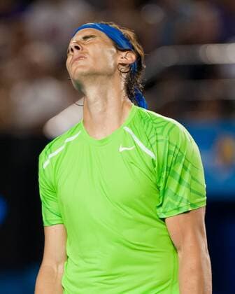 (120129) -- MELBOURNE, Jan. 29, 2012 (Xinhua) -- Rafael Nadal of Spain reacts during the men s singles final at 2012 Australian Open tennis tournament in Melbourne, Australia, on Jan. 29, 2012. (Xinhua Bai Xue) (hy) AUSTRALIA-MELBOURNE-TENNIS-MEN S-FINAL 
