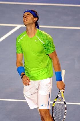 (120129) -- MELBOURNE, Jan. 29, 2012 (Xinhua) -- Rafael Nadal of Spain reacts during the men s singles final at 2012 Australian Open tennis tournament in Melbourne, Australia, on Jan. 29, 2012. (Xinhua Guo Yong) (hy) AUSTRALIA-MELBOURNE-TENNIS-MEN S-FINAL 