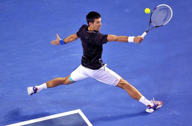 (120129) -- MELBOURNE, Jan. 29, 2012 (Xinhua) -- Novak Djokovic of Serbia hits a return during their men s singles final at 2012 Australian Open tennis tournament in Melbourne, Australia, on Jan. 29, 2012. (Xinhua Chen Xiaowei) (hy) AUSTRALIA-MELBOURNE-TENNIS-MEN S-FINAL 