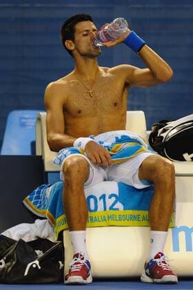 29.01.2012 Australian Open Tennis from Melbourne Park. Novak Djokovic (SRB) drinks during a change over in his match on the fourteenth day of the Australian Open Tennis Championships in Melbourne, Australia. xEstherxLimx  ActionPlus20215996