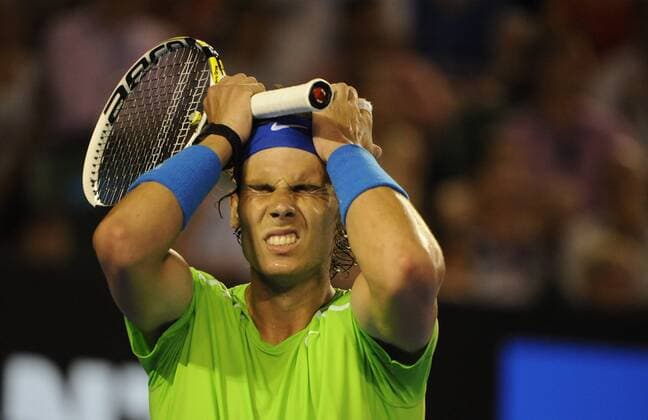 29.01.2012 Melbourne, Australia. Nadal starts to feel the pressure on Day 14 of the men s final match. Rafael Nadal (ESP). Djokovic defeats Nadal 5-7, 6-4, 6-2, 6-7, 7-5 played on Rod Laver Arena at the Australian Open. xPeterxBlakemanx  ActionPlus11240105