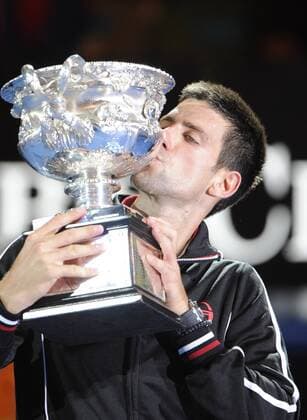29.01.2012 Melbourne, Australia. Djokovic kisses the trophy after recieving it on Day 14 of the men s final match. Novak Djokovic (SRB) played on Rod Laver Arena at the Australian Open. xPeterxBlakemanx  ActionPlus20144671