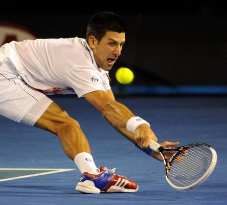 (120129) -- MELBOURNE, Jan. 29, 2012 (Xinhua) -- Novak Djokovic of Serbia hits a return during the men s singles final at 2012 Australian Open tennis tournament in Melbourne, Australia, on Jan. 29, 2012. (Xinhua Guo Yong) (hy) AUSTRALIA-MELBOURNE-TENNIS-MEN S-FINAL 