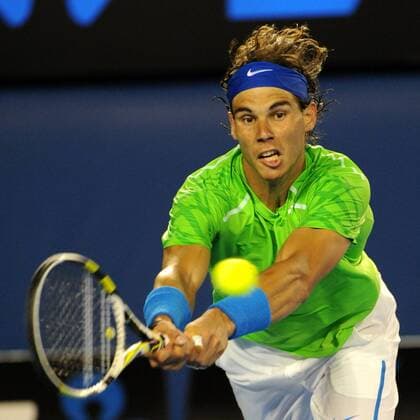 (120129) -- MELBOURNE, Jan. 29, 2012 (Xinhua) -- Rafael Nadal of Spain hits a return during the men s singles final at 2012 Australian Open tennis tournament in Melbourne, Australia, on Jan. 29, 2012. (Xinhua Guo Yong) (hy) AUSTRALIA-MELBOURNE-TENNIS-MEN S-FINAL 