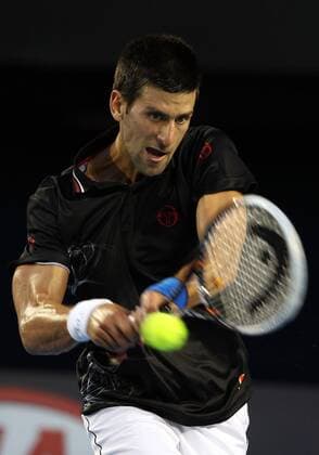 January 29, 2012: Novak Djokovic (SRB) hits a shot during the finals of the Australian Open at Melbourne Park Tennis Centre in Melbourne, Australia. TENNIS: JAN 29 Australian Open - Men s Final Icon120129003 EDITORIAL USE ONLY