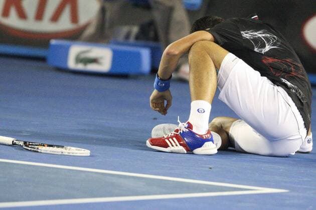 29 January 2012 : Novak Djokovic (SRB) in his final match on the floor after losing an exhausting point during Day 14 of the Mens final of the Australian Tennis open grand slam event at Melbourne Park, Melbourne Australia. TENNIS: JAN 29 Australian Open - Men s Final Icon12012921 EDITORIAL USE ONLY