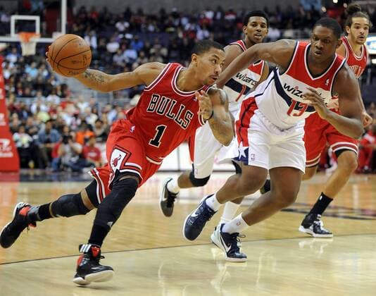 Jan. 30, 2012 - Washington, DC, USA - Chicago Bulls point guard Derrick Rose (1) drives around Washington Wizards forward Kevin Seraphin (13) during first-half action at the Verizon Center in Washington, D.C., Monday, January 30, 2012. Bulls v Wizards - ZUMAm67