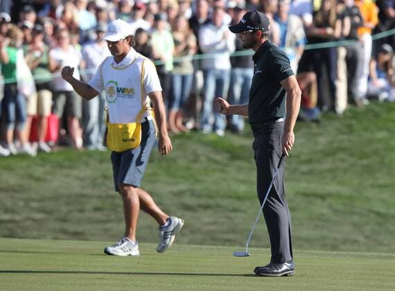 Feb. 5, 2012 - Phoenix, Arizona, U.S. - 5 February 2012: Kyle Stanley and his caddie both pump fists as Stanley makes the putt and wins the Waste Management Phoenix Open. - ZUMAx81