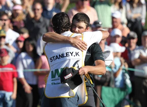 Feb. 5, 2012 - Phoenix, Arizona, U.S. - 5 February 2012: Kyle Stanley embraces his caddie after making the final putt on the 18th hole. Stanley wins the Waste Management Phoenix Open. - ZUMAx81