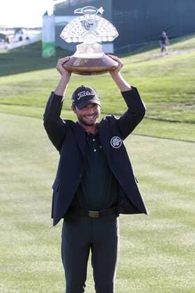 Feb. 5, 2012 - Phoenix, Arizona, U.S. - 5 February 2012: Kyle Stanley hoists the trophy over his head after winning the 2012 Waste Management Phoenix Open. - ZUMAx81