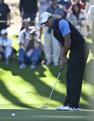 Tiger Woods watches a birdie putt come up short on the 14th green at Spyglass Hill Golf Course in the opening day of the AT&T Pro-Am at Pebble Beach, California on February 9, 2012.  SXP2012020908