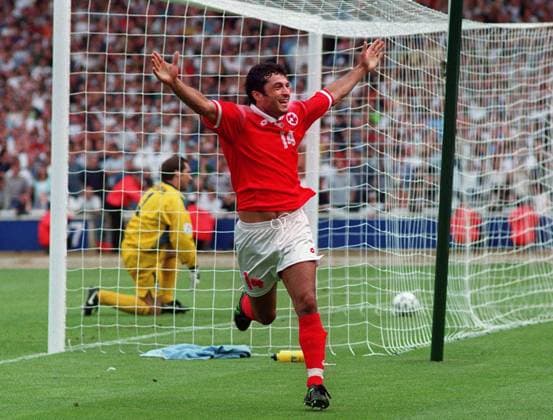 KUBILAY TURKYILMAZ CELEBRATES HIS PENALTY GOAL FOR SWITZERLAND, WITH DAVID SEAMAN IN BACKGROUND. EURO 96 FOOTBALL - ENGLAND v SWITZERLAND, WEMBLEY, 8 6 1996.