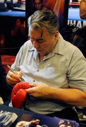 Feb. 18, 2012 - Las Vegas, Nevada, US - Retired boxer GEORGE CHUVALO signs a boxing glove during a meet and greet session at the MGM Grand Hotel on Saturday, Feb. 18, 2012 in Las Vegas, Nevada. Chuvalo along with other retired boxers greeted boxing fans at the MGM in conjunction with the Keep Memory Alive s 16th Annual Power of Love Gala honoring Muhammad Ali s 70th birthday. Boxers Sign Autographs In Las Vegas - ZUMAbk3