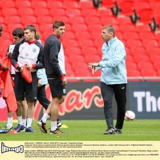Englands Steven Gerrard watches Stuart Pearce during training..England Training at Wembley Stadium, London. 28th February 2012. EDITORIAL USE ONLY. No use with unauthorised audio, video, data, fixture lists, club league logos or live services. Online in-match use limited to 120 images, no video emulation. No use in betting, games or single club league player publications.