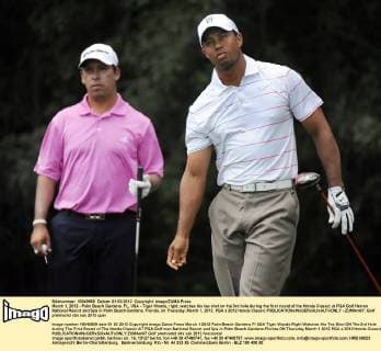 March 1, 2012 - Palm Beach Gardens, FL, USA - Tiger Woods, right, watches his tee shot on the 3rd hole during the first round of the Honda Classic at PGA Golf Herren National Resort and Spa in Palm Beach Gardens, Florida, on Thursday, March 1, 2012. PGA s 2012 Honda Classic - ZUMAm67