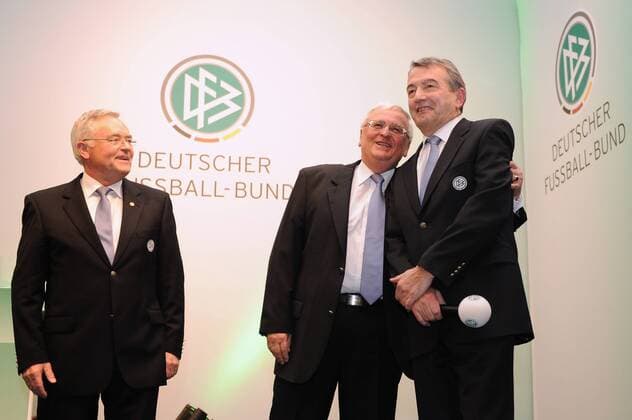 FRANKFURT AM MAIN, GERMANY - MARCH 02: Horst R Schmidt, former DFB president Theo Zwanziger and newly elected DFB president Wolfgang Niersbach stand on the stage during the DFB federal meeting at Steigenberger Airport Hotel on March 2, 2012 in Frankfurt am Main, Germany. Poolfoto Local Caption Wolfgang Niersbach; Horst R Schmidt; Theo Zwanziger 140480848