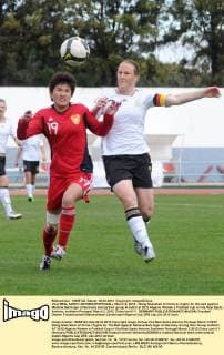 VILA REAL SANTO ANTONIO(PORTUGAL), March 2, 2012 - Wang Shanshan of China (L) fights for the ball against Melanie Behringer of Germany during their group A match at 2012 Algarve Women s Football Cup in Vila Real Santo Antonio, southern Portugal, March 2, 2012. China lost 0-1. GERMANY 