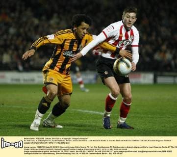 FC Hull City - Southampton FC, Southampton s Adam Lallana and Hull s Liam Rosenior battle at The KC Stadium 