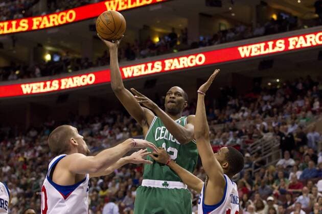 March 23, 2012: Boston Celtics forward JaJuan Johnson (12) puts up the shot over Philadelphia 76ers center Spencer Hawes (00) and shootingguard Evan Turner (12) during the NBA Basketball Herren USA game between the Boston Celtics and the Philadelphia 76ers at the Wells Fargo Center in Philadelphia, Pennsylvania. The Philadelphia 76ers beat the Boston Celtics, 99-86. NBA Basketball Herren USA 2012: Celtics vs 76ers MAR 23 - ZUMAcs7