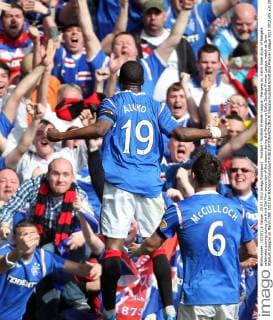 Football - Scottish Premier League - Rangers vs. Celtic Sone Aluko of Rangers celebrates scoring during the third Old Firm encounter of the season during the Rangers vs Celtic Scottish Premier League match at Ibrox Stadium Glasgow on March 25th 2012 Ian MacNicol Colorsport 