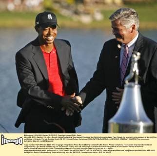 March 25, 2012 - Sanford, FL, USA - Arnold Palmer Invitational Tournament Chairman Don Oehlrich congratulates Tiger Woods for winning the tournament at Bay Hill Club and Lodge in Orlando, Florida, Sunday, March 25, 2012. Arnold Palmer Invitational - ZUMAm67