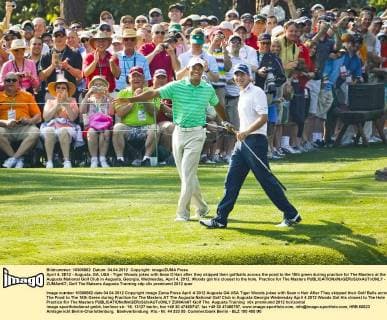 April 4, 2012 - Augusta, GA, USA - Tiger Woods jokes with Sean O Hair after they skipped their golfballs across the pond to the 16th green during practice for The Masters at the Augusta National Golf Club in Augusta, Georgia, Wednesday, April 4, 2012. Woods got his closest to the hole. Practice for The Masters - ZUMAm67