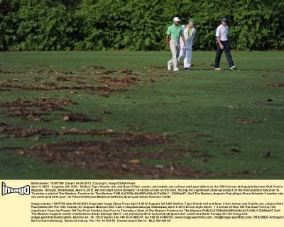April 4, 2012 - Augusta, GA, USA - Golfers Tiger Woods, left, and Sean O Hair, center, and caddie Joe LaCava walk past debris on the 13th fairway at Augusta National Golf Club in Augusta, Georgia, Wednesday, April 4, 2012. An overnight storm dumped 1.4 inches of rain on the area, forcing the significant clean-up project on the final practice day prior to Thursday s start of The Masters. Practice for The Masters - ZUMAm67