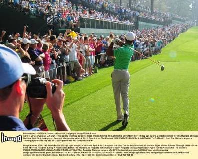 April 4, 2012 - Augusta, GA, USA - The gallery watches as golfer Tiger Woods follows through on his drive from the 14th tee box during a practice round for The Masters at Augusta National Golf Club in Augusta, Georgia, Wednesday, April 4, 2012. Practice for The Masters - ZUMAm67
