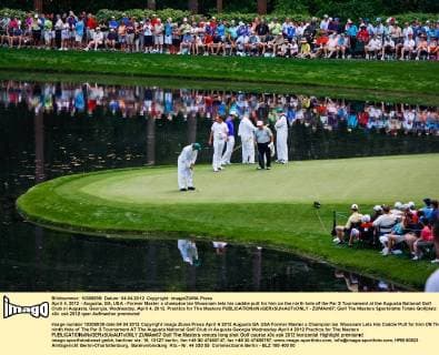 April 4, 2012 - Augusta, GA, USA - Former Master s champion Ian Woosnam lets his caddie putt for him on the ninth hole of the Par 3 Tournament at the Augusta National Golf Club in Augusta, Georgia, Wednesday, April 4, 2012. Practice for The Masters - ZUMAm67
