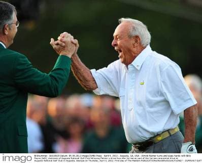 April 5, 2012 - Augusta, GA, USA - Arnold Palmer turns and slaps hands with Billy Payne (left), chairman of Augusta National Golf Club following Palmer s drive from the 1st tee as part of the 1st tee ceremonial drive at Augusta National Golf Club in Augusta, Georgia on Thursday, April 5, 2012. First day of The Masters - ZUMAm67