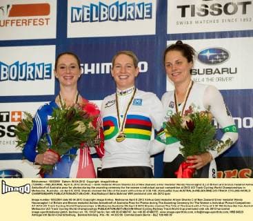 (120408) -- MELBOURNE, April 8, 2012 (Xinhua) -- Gold medalist Alison Shanks (C) of New Zealand, silver medalist Wendy Houvenaghel (L) of Britain and bronze medalist Ashlee Ankudinoff of Australia pose for photos during the awarding ceremony for the women s individual pursuit competition at 2012 UCI Track Cycling World Championships in Melbourne, Australia , on April 8, 2012. Shanks claimed the title of the event with a time of 3:30.199. (Xinhua Bai Xue) AUSTRALIA-MELBOURNE-UCI-TRACK CYCLING-WORLD CHAMPIONSHIPS 