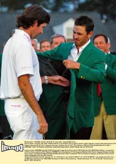 April 8, 2012 - Augusta, GA, USA - Bubba Watson is presented with his green jacket by 2011 Masters winner Charl Schwartzel at the Augusta National Golf Club in Augusta, Georgia, Sunday, April 8, 2012. The Masters - ZUMAm67