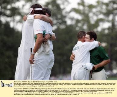 April 8, 2012 - Augusta, GA, USA - Bubba Watson, left, and Louis Oosthuizen hug their caddies after Watson defeated Oosthuizen in a playoff on the 10th green during the final round of the Masters at the Augusta National Golf Club in Augusta, Georgia, Sunday, April 8, 2012. The Masters - ZUMAm67