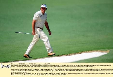 April 8, 2012 - Augusta, GA, USA - Phil Mickelson walks along the lip of a sand trap on the second green during the Masters at the Augusta National Golf Club in Augusta, Georgia, Sunday, April 8, 2012. The Masters - ZUMAm67