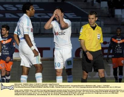 Brandao - Andre Pierre Gignac (Olympique Marseille) - Clement Turpin (Referee) Football : Olympique Marseille vs Montpellier HSC - Ligue 1 - 11 04 2012 FranckPennant Panoramic 