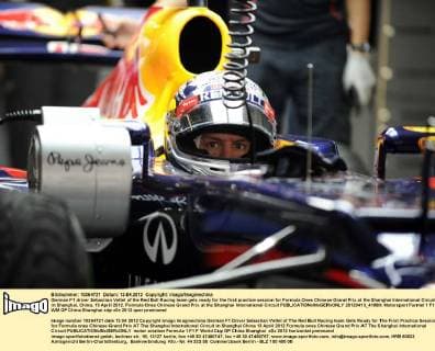 German F1 driver Sebastian Vettel of the Red Bull Racing team gets ready for the first practice session for Formula Ones Chinese Grand Prix at the Shanghai International Circuit in Shanghai, China, 13 April 2012. Formula Ones Chinese Grand Prix at the Shanghai International Circuit  20120413_41880